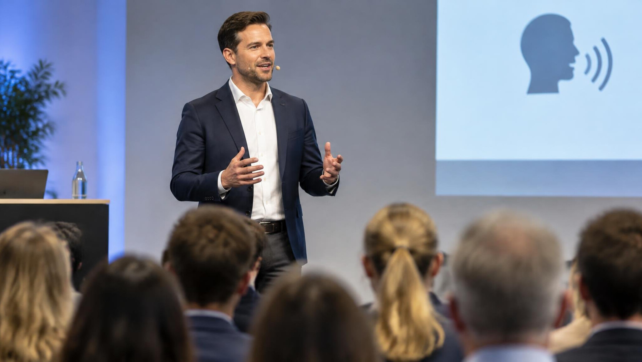 german public speaker on stage